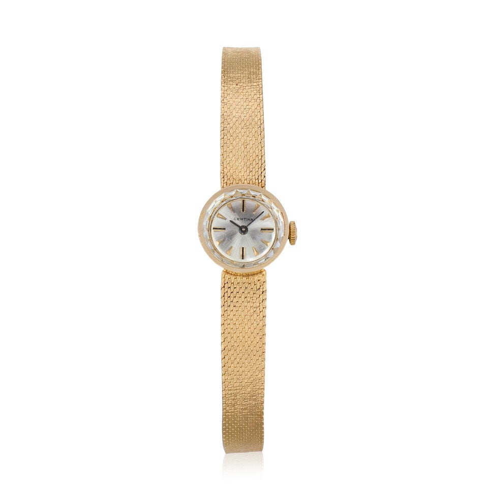 Certina. A lady's 14K gold manual wind bracelet watch Circa 1960: Certina. A lady's 14K gold manual wind bracelet watch Date: Circa 1960 Movement: 17-jewel Cal.13-50 manual wind Dial: Sunburst silvered Case: Brushed and polished round, No.665020 Strap/Bracelet: Inte