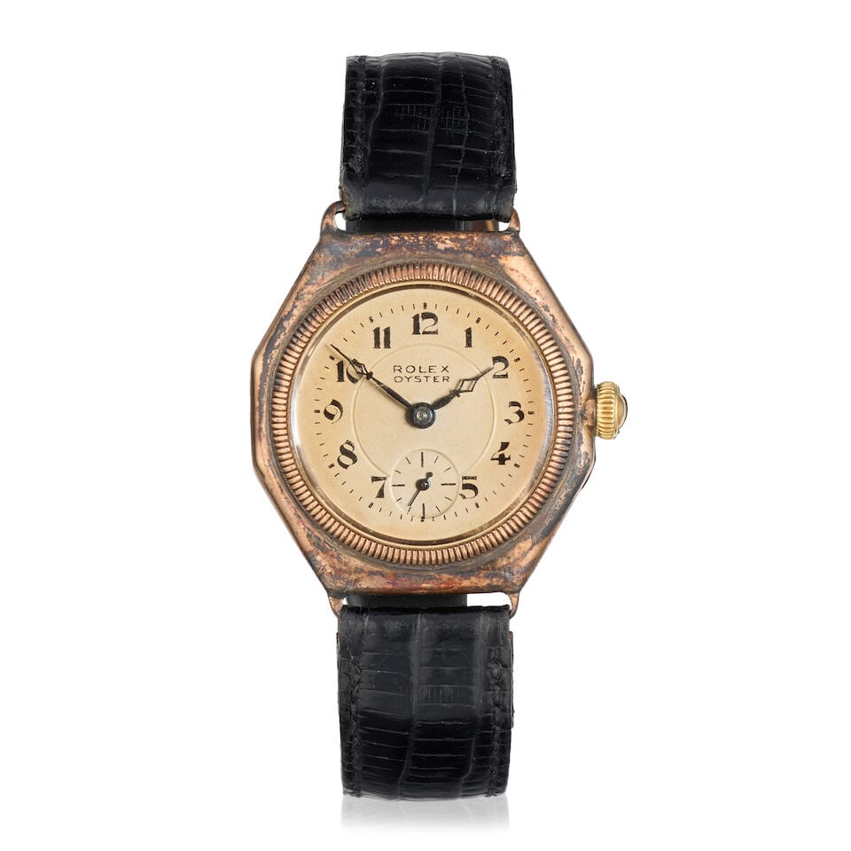Rolex. A 9K gold manual wind wristwatch Glasgow Import mark for 1928: Rolex. A 9K gold manual wind wristwatch Date: Glasgow Import mark for 1928 Movement: 15-jewel manual wind Dial: Silvered Case: Polished hexagonal form, No.23700 Strap/Bracelet: Associated black lizard