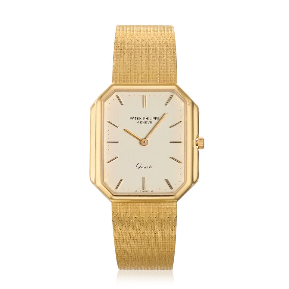 Patek Philippe. An 18K gold quartz bracelet watch Ref: 3853/3, Circa 1990: Patek Philippe. An 18K gold quartz bracelet watch Reference: 3853/3 Date: Circa 1990 Movement: 6-jewel Cal.E 27 quartz, No.1504601 Dial: Silvered Case: Brushed and polished hexagonal form,