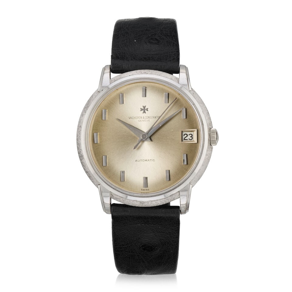 Vacheron Constantin. An 18K white gold automatic calendar wristwatch Ref: 63940, Circa 1960: Vacheron Constantin. An 18K white gold automatic calendar wristwatch Reference: 63940 Date: Circa 1960 Movement: Jewelled automatic Dial: Sunburst silvered Case: Brushed and polished round, textured
