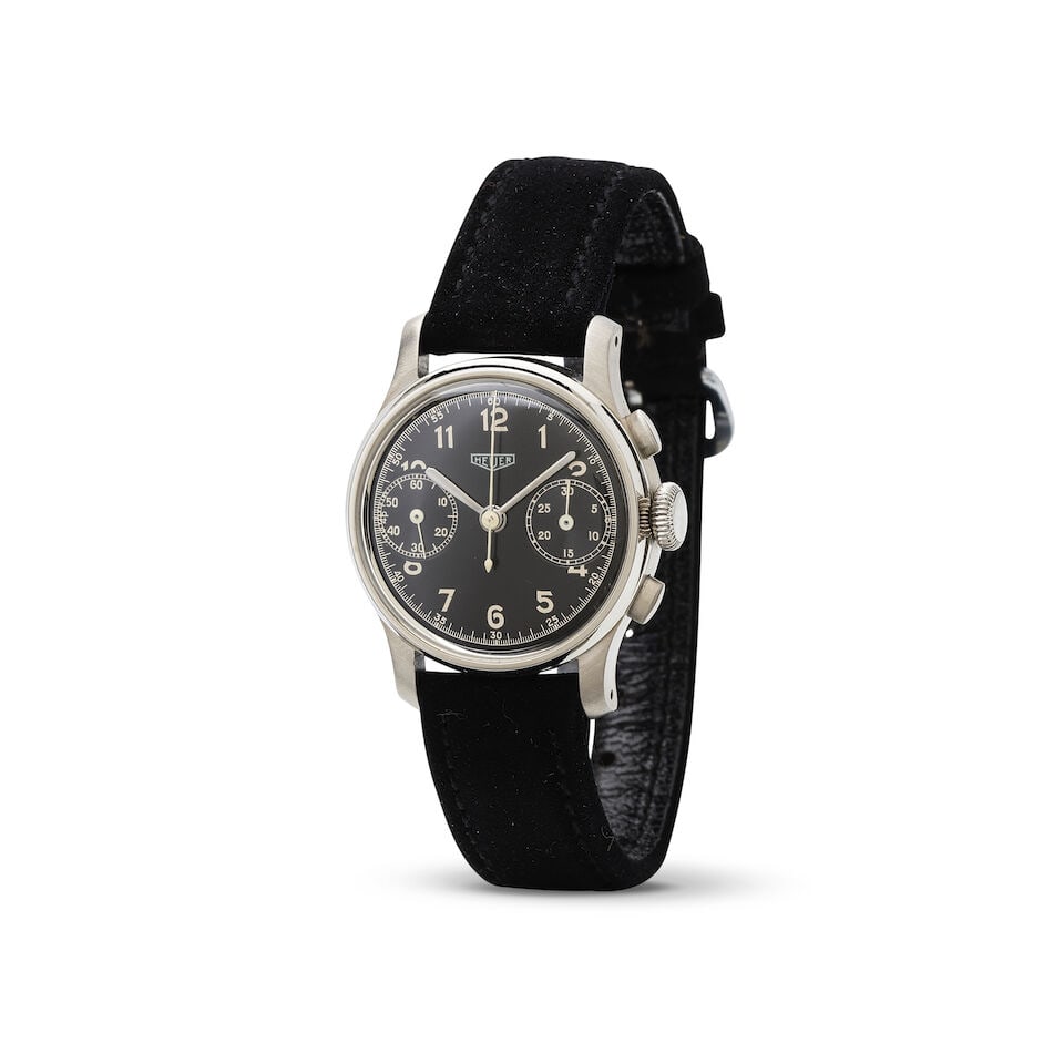 Heuer. A stainless steel manual wind chronograph wristwatch Heuer. Chronographe bracelet en acie...: Heuer. A stainless steel manual wind chronograph wristwatch Heuer. Chronographe bracelet en acier mouvement mécanique Date: Circa 1960 Movement: Jewelled manual wind Dial: Black, signed Case: Pol