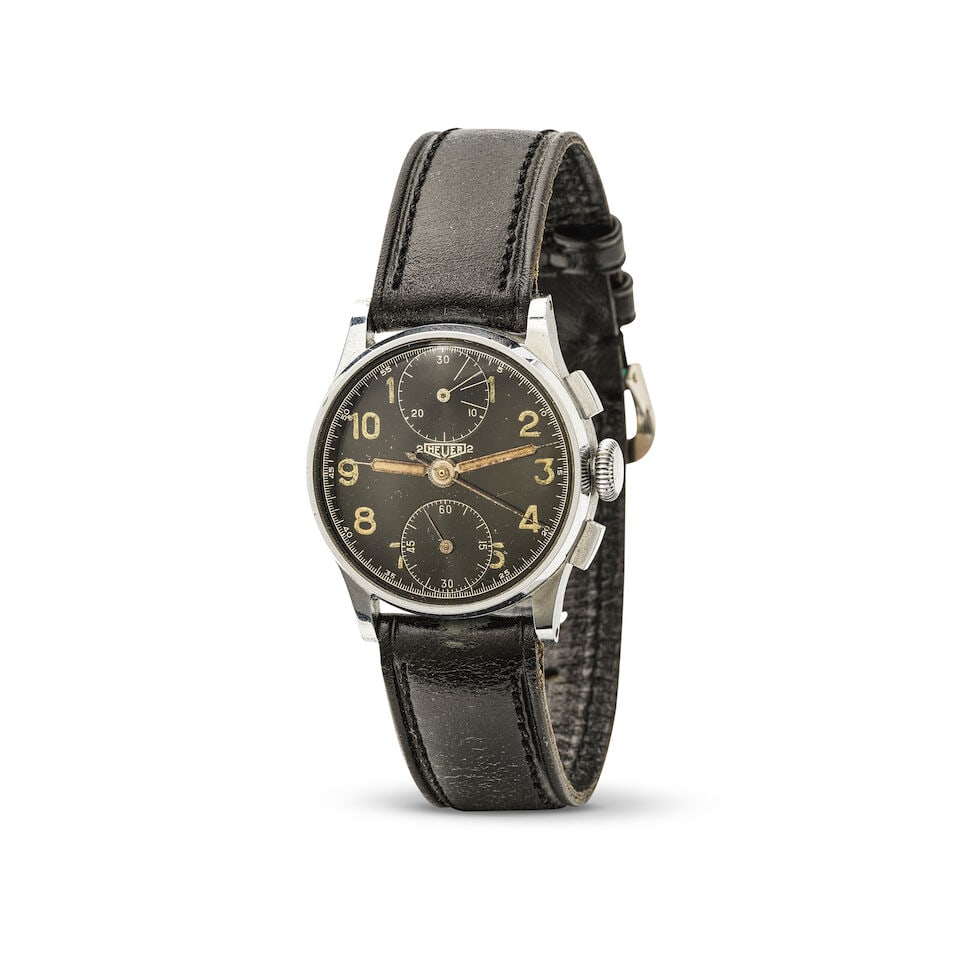 Heuer. A chrome plated and steel manual wind chronograph wristwatch Heuer. Chronographe bracelet...: Heuer. A chrome plated and steel manual wind chronograph wristwatch Heuer. Chronographe bracelet en plaqué chrome et acier mouvement mécanique Date: Circa 1940 Movement: Jewelled manual wind