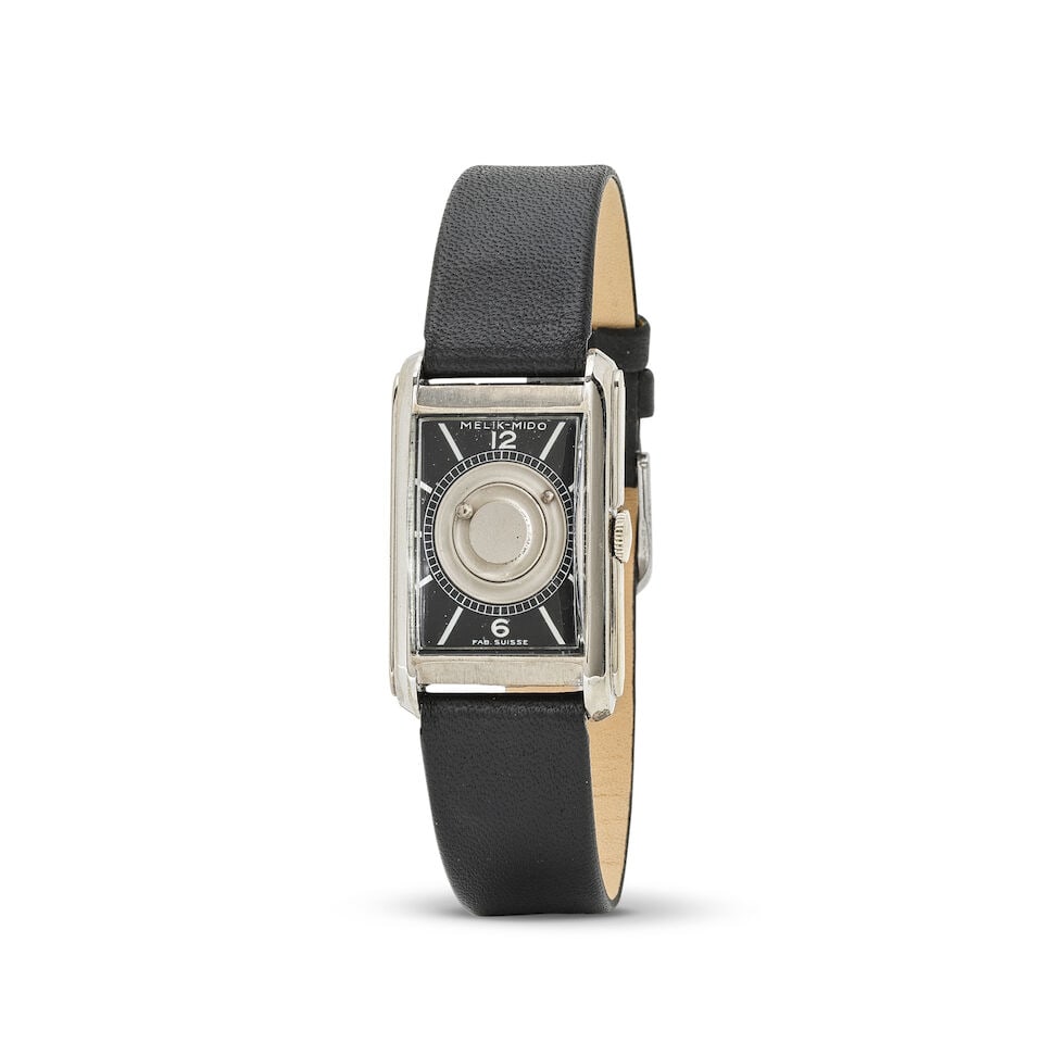 Mido. An unusual nickel chrome plated manual wind rectangular wristwatch with mysterious dial Mi...: Mido. An unusual nickel chrome plated manual wind rectangular wristwatch with mysterious dial Mido. Montre bracelet rectangulaire en nickel chromé à cadran mystère mouvement mécani