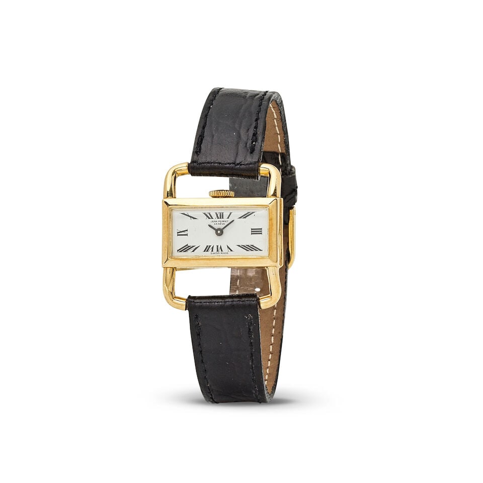 Jean Perret. An 18K gold manual wind rectangular wristwatch with stirrup form lugs Jean Perret. ...: Jean Perret. An 18K gold manual wind rectangular wristwatch with stirrup form lugs Jean Perret. Montre bracelet en or jaune 18K (750) de forme rectangulaire et anses en étrier mouvement