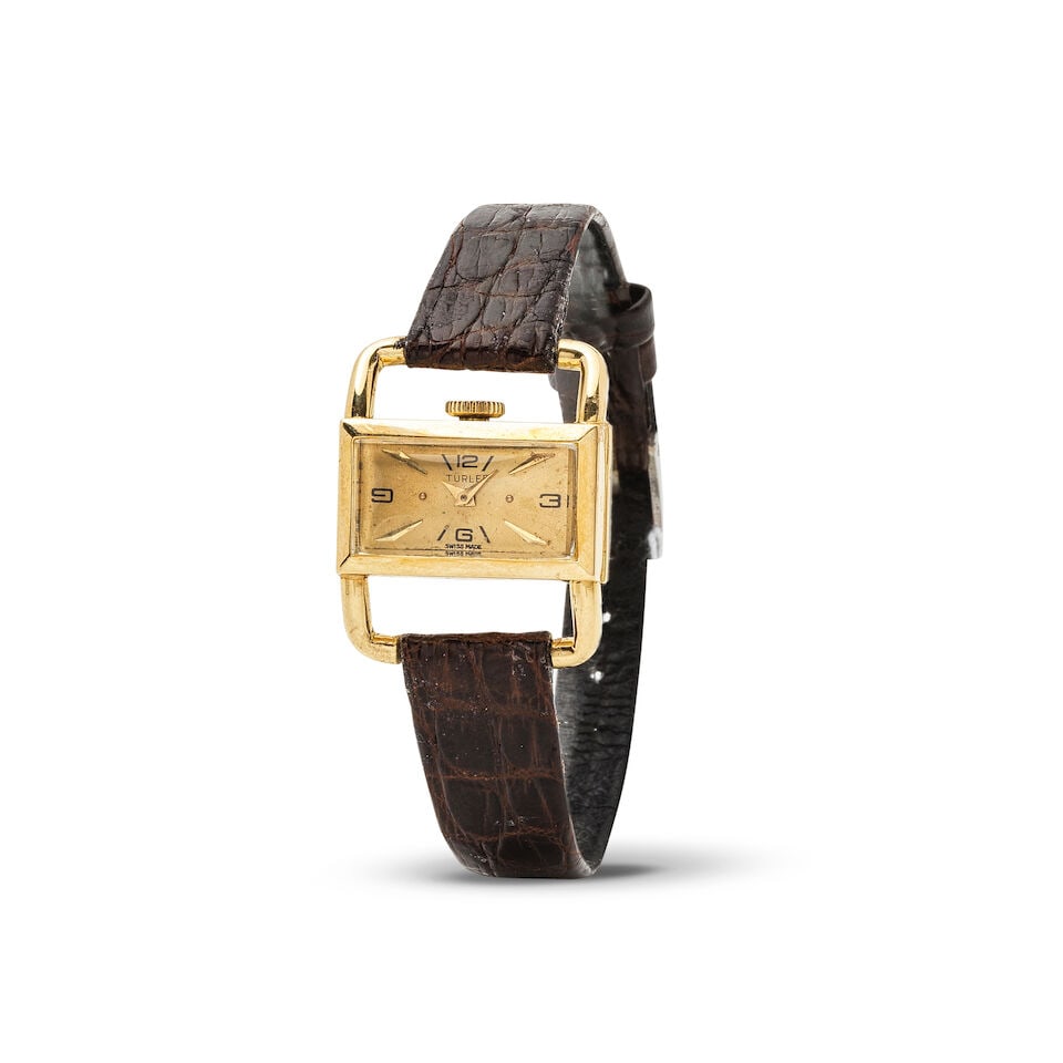 Türler. A lady's 18K gold manual wind rectangular wristwatch with stirrup form lugs Tü...: Türler. A lady's 18K gold manual wind rectangular wristwatch with stirrup form lugs Türler. Montre bracelet de dame en or jaune 18K (750) de forme rectangulaire et anses en étrier mouve