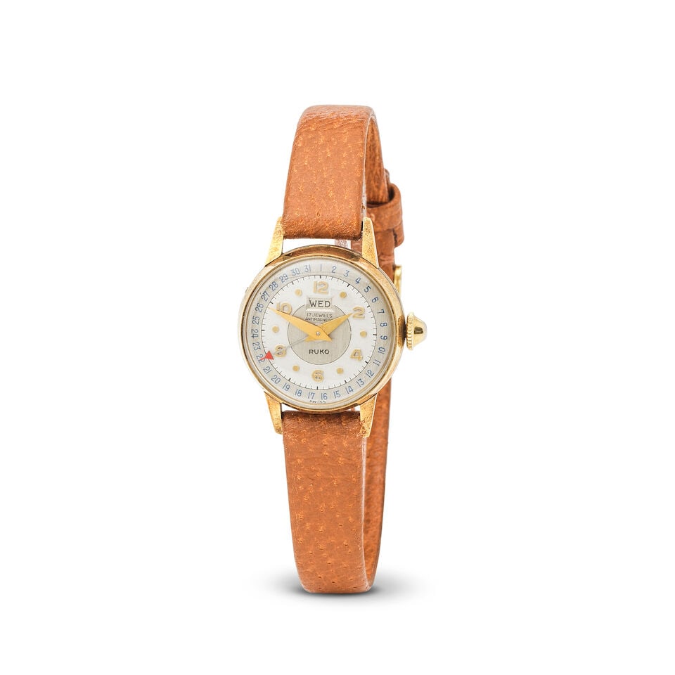 Ruko. A lady's 14K gold manual wind calendar wristwatch Ruko. Montre de dame en or jaune 14K (58...: Ruko. A lady's 14K gold manual wind calendar wristwatch Ruko. Montre de dame en or jaune 14K (585) avec date mouvement mécanique Date: Circa 1950 Movement: 17-jewel Britix Watch Co manual wind Di