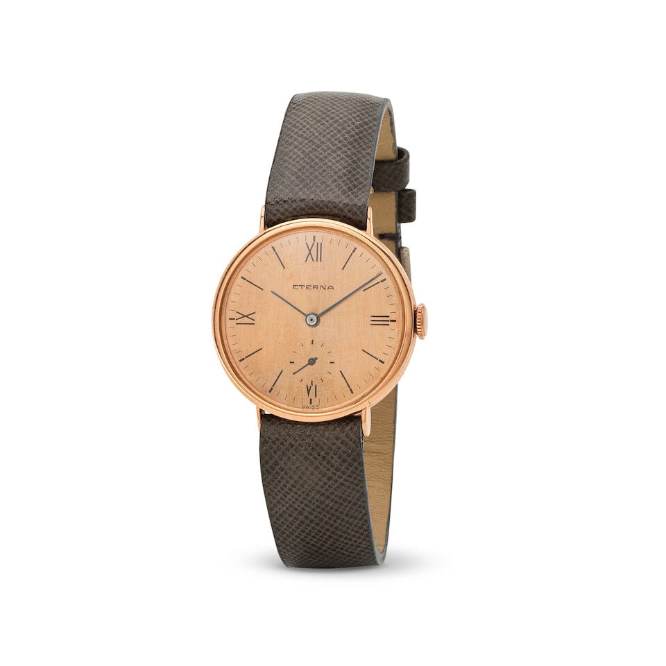 Eterna. A 14K rose gold manual wind wristwatch Eterna. Montre bracelet en or rose 14K (750) mouv...: Eterna. A 14K rose gold manual wind wristwatch Eterna. Montre bracelet en or rose 14K (750) mouvement mécanique Date: Circa 1950 Movement: Jewelled Cal.600 manual wind, No.2924341 Dial: Pink