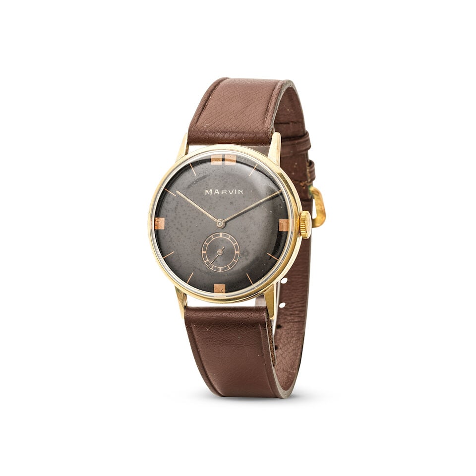 Marvin. A gold plated oversize manual wind wristwatch Marvin. Montre bracelet en plaqué ove...: Marvin. A gold plated oversize manual wind wristwatch Marvin. Montre bracelet en plaqué oversize mouvement mécanique Date: Circa 1950 Movement: Jewelled manual wind (access to the movement t