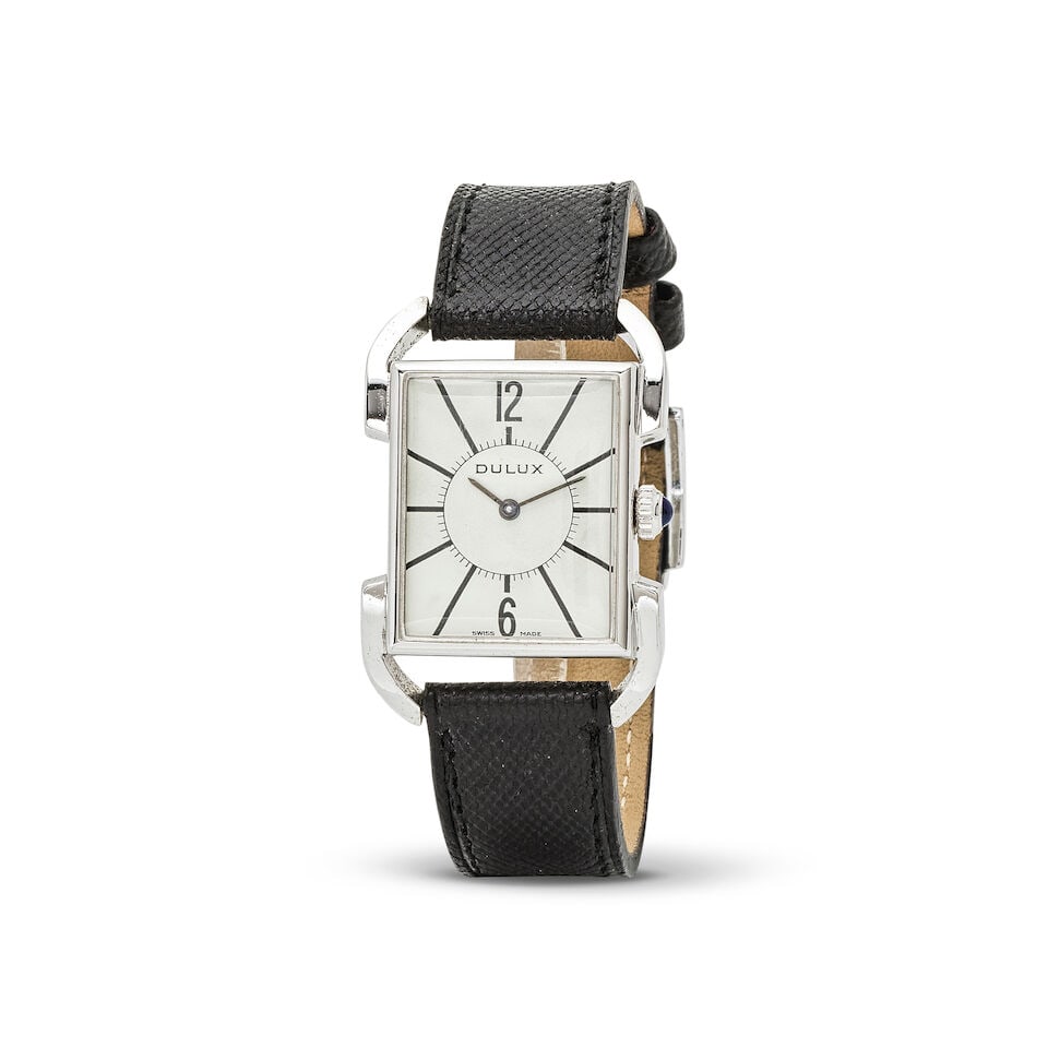 Dulux. A steel and chrome plated manual wind rectangular wristwatch Dulux. Montre bracelet recta...: Dulux. A steel and chrome plated manual wind rectangular wristwatch Dulux. Montre bracelet rectangulaire en acier et plaqué chrome mouvement mécanique Date: Circa 1980 Movement: 17-jewel