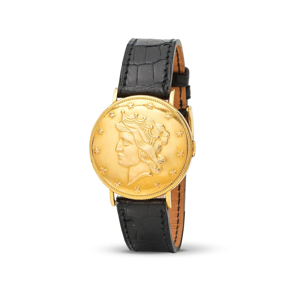 Louvic. A metal gold plated manual wind coin wristwatch with concealed dial Louvic. Montre brace...: Louvic. A metal gold plated manual wind coin wristwatch with concealed dial Louvic. Montre bracelet en métal plaqué or dissimulée dans une pièce de monnaie mouvement