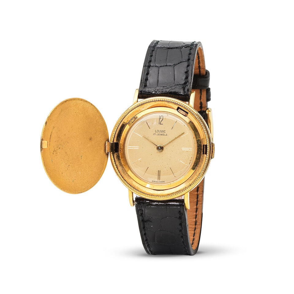 Louvic. A metal gold plated manual wind coin wristwatch with concealed dial Louvic. Montre brace... - 2