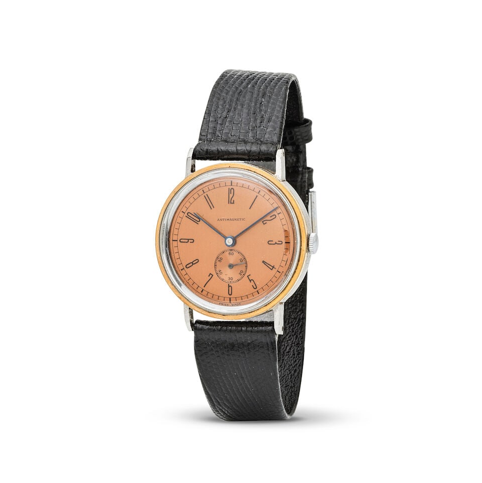 A steel and rose gold plated manual wind wristwatch Montre bracelet en plaqué or rose et ac...: A steel and rose gold plated manual wind wristwatch Montre bracelet en plaqué or rose et acier mouvement mécanique Date: Circa 1940 Movement: Jewelled manual wind Dial: Salmon Case:
