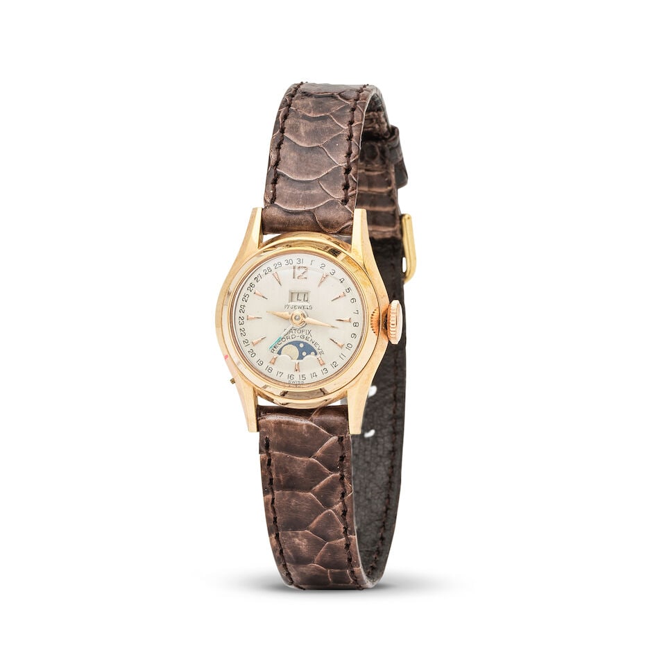 Record. A lady's gold plated manual wind calendar wristwatch with moon phase indication Record. ...: Record. A lady's gold plated manual wind calendar wristwatch with moon phase indication Record. Montre de dame en plaqué or avec date et phase de lune mouvement mécanique Model: Lady Datofix