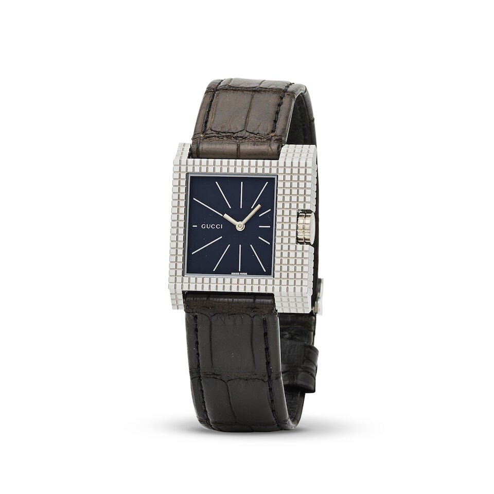 Gucci. A stainless steel quartz square form wristwatch Gucci. Montre bracelet de forme carré...: Gucci. A stainless steel quartz square form wristwatch Gucci. Montre bracelet de forme carrée en acier mouvement quartz Model: 7100M Date: Circa 2000 Movement: 6-jewel ETA Cal.256.041