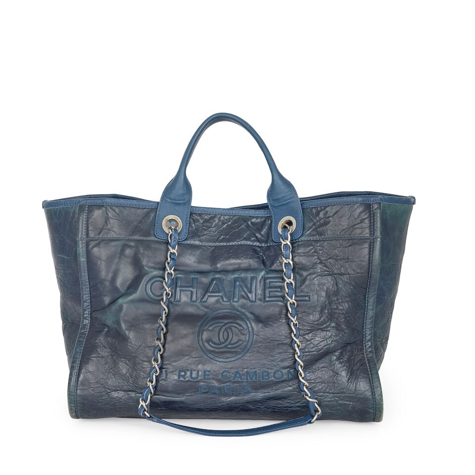 Chanel: a Blue Glazed Leather Small Deauville Bag 2016-17 (includes serial sticker): Chanel: a Blue Glazed Leather Small Deauville Bag 2016-17 Creative Director: Karl Lagerfeld Glazed calfskin with Caviar leather trim and handles, silver tone hardware Condition Grade C- 38cm wide, 30c