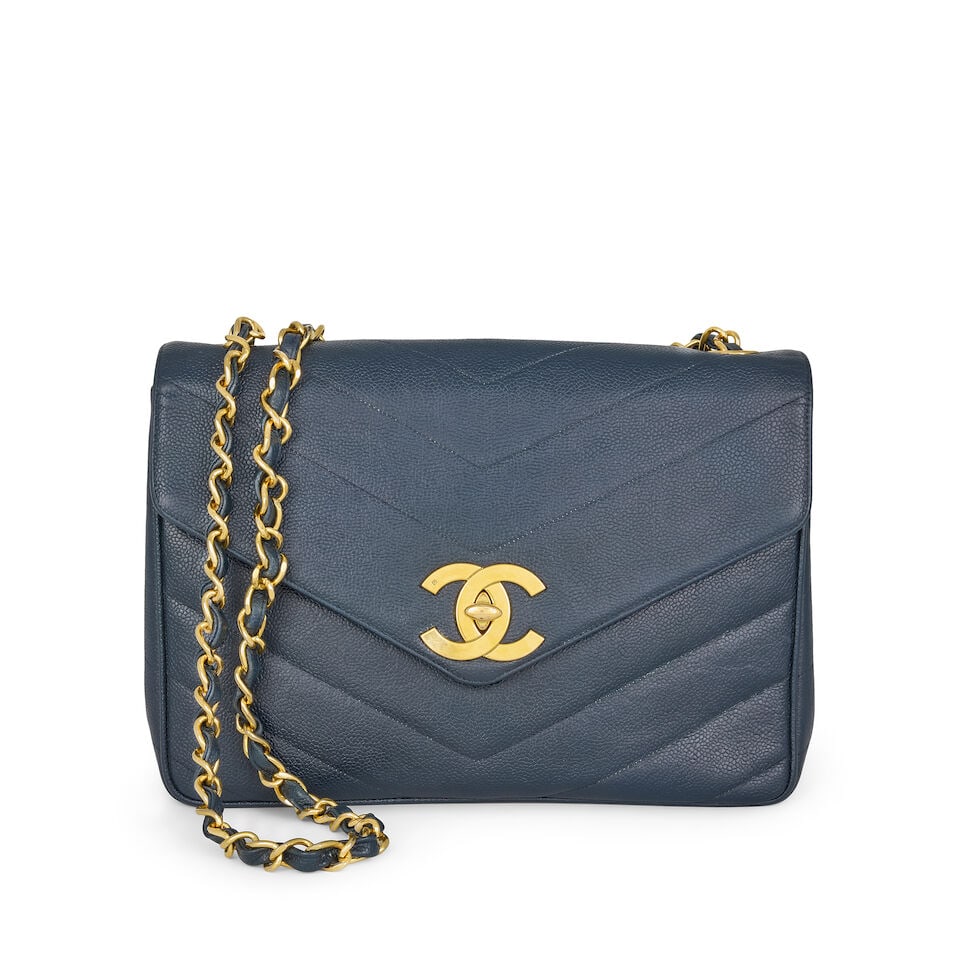Chanel: a Navy Blue Chevron Quilted Caviar Leather Flap Bag 1994-96 (includes dust bag) (1 of 3)