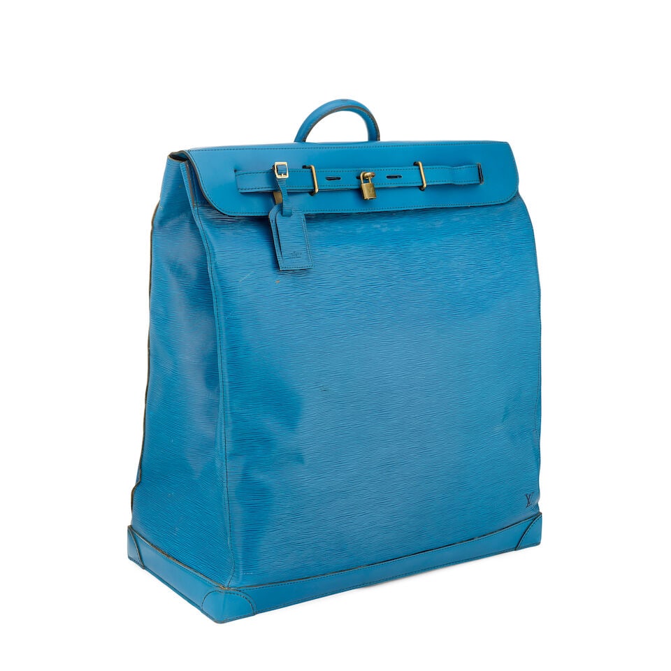 Louis Vuitton: a Blue Epi Leather Steamer Bag 55 1984 (includes luggage tag, padlock and key): Louis Vuitton: a Blue Epi Leather Steamer Bag 55 1984 In blue Epi leather with blue leather trim, brass hardware Condition Grade C+ 55cm wide, 60cm high, 26cm deep, includes luggage tag, padlock and k