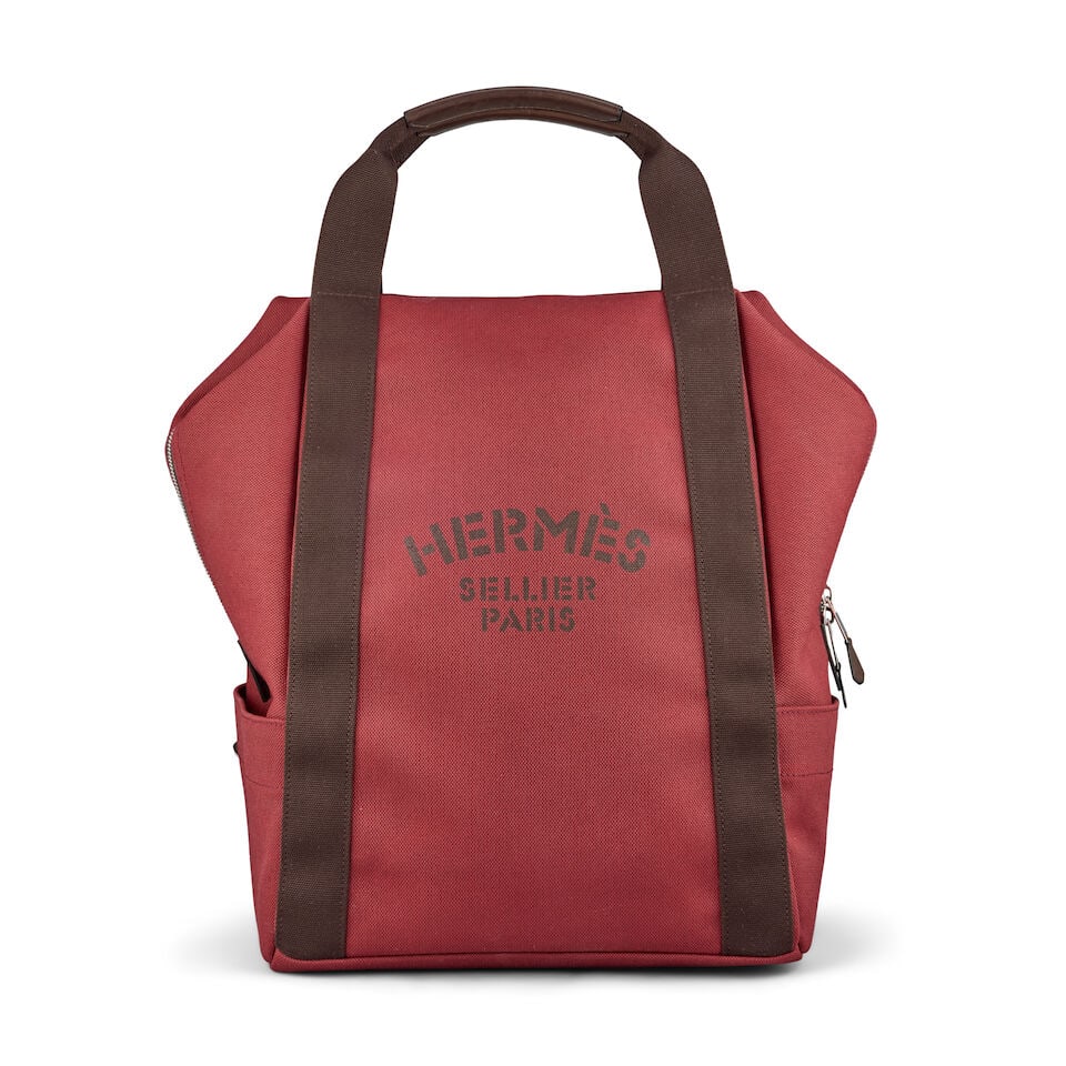 Hermès: a Rouge H and Chocolat Groom Backpack: Hermès: a Rouge H and Chocolat Groom Backpack Multi-compartment backpack with 'Hermès Sellier Paris' print on the front, lined in dark brown canvas, palladium hardware Condition Grade A- 31c