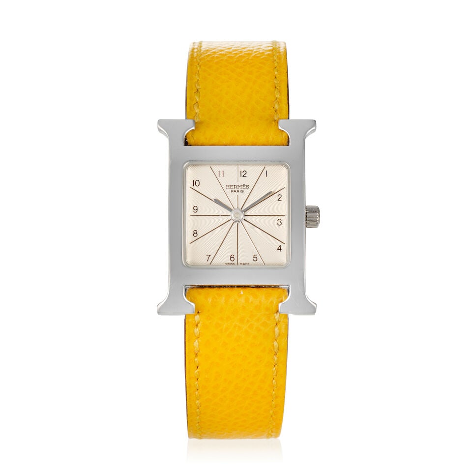 Hermès: a Stainless Steel Heure H 21mm Quartz Wristwatch Ref: HH1.210, 2004 (includes pouch): Hermès: a Stainless Steel Heure H 21mm Quartz Wristwatch Ref: HH1.210, 2004 Quartz movement with yellow Epsom leather strap Condition Grade B+ Case 21mm x 30mm, approx. 14.5-17.5cm wrist size,