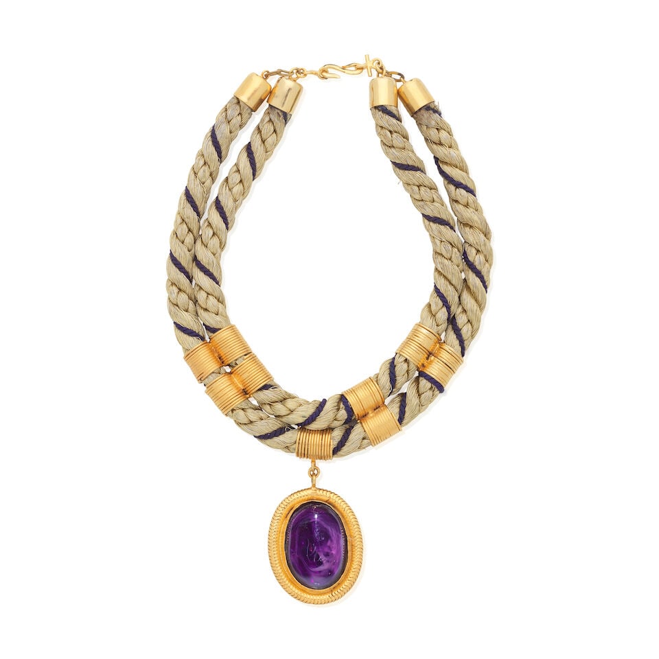 Chanel: a Gold Rope Twist and Amethyst Glass Necklace 1970s: Chanel: a Gold Rope Twist and Amethyst Glass Necklace 1970s Metallic gold thread rope-twist choker necklace with gripoix purple glass pendant in gold tone metal mount Condition Grade B 21cm drop, pend