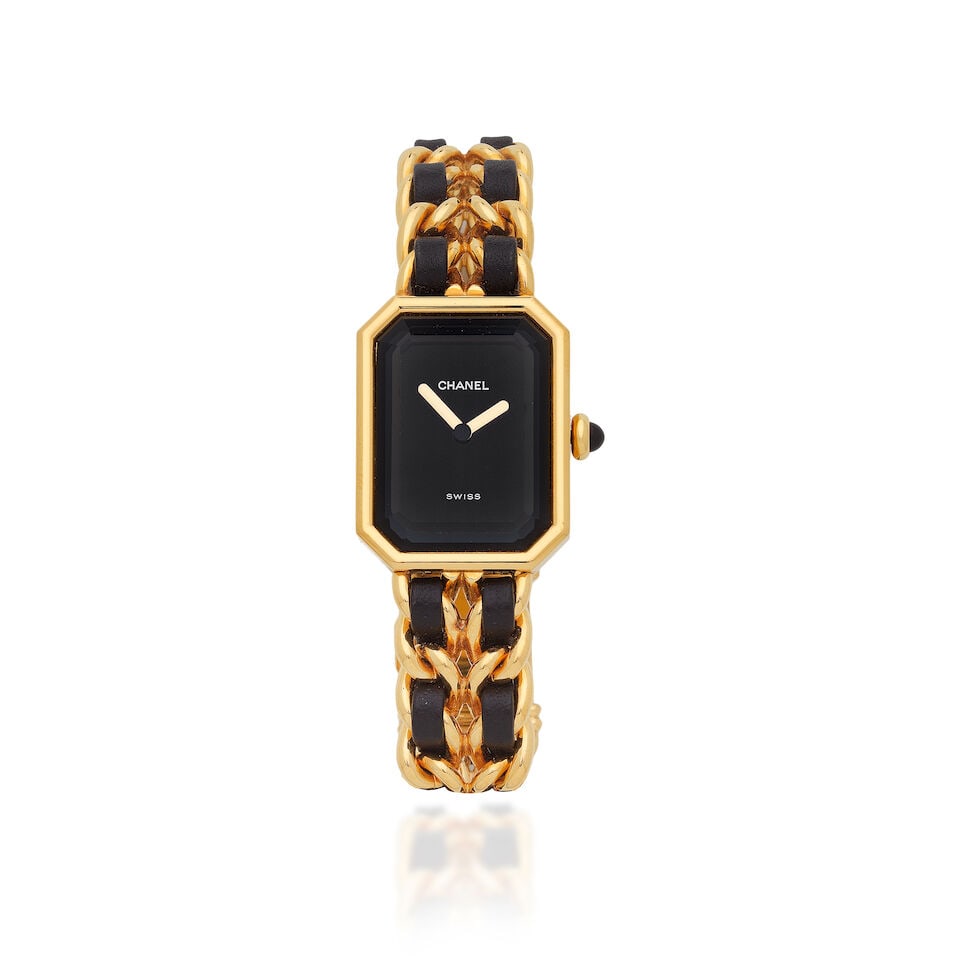 Chanel: a Gold Plated 'Première' Quartz Bracelet Watch 1990s: Chanel: a Gold Plated 'Première' Quartz Bracelet Watch 1990s Creative Director: Karl Lagerfeld Black interwoven leather trim bracelet Condition Grade A- Size L, case 20mm x 26mm For further