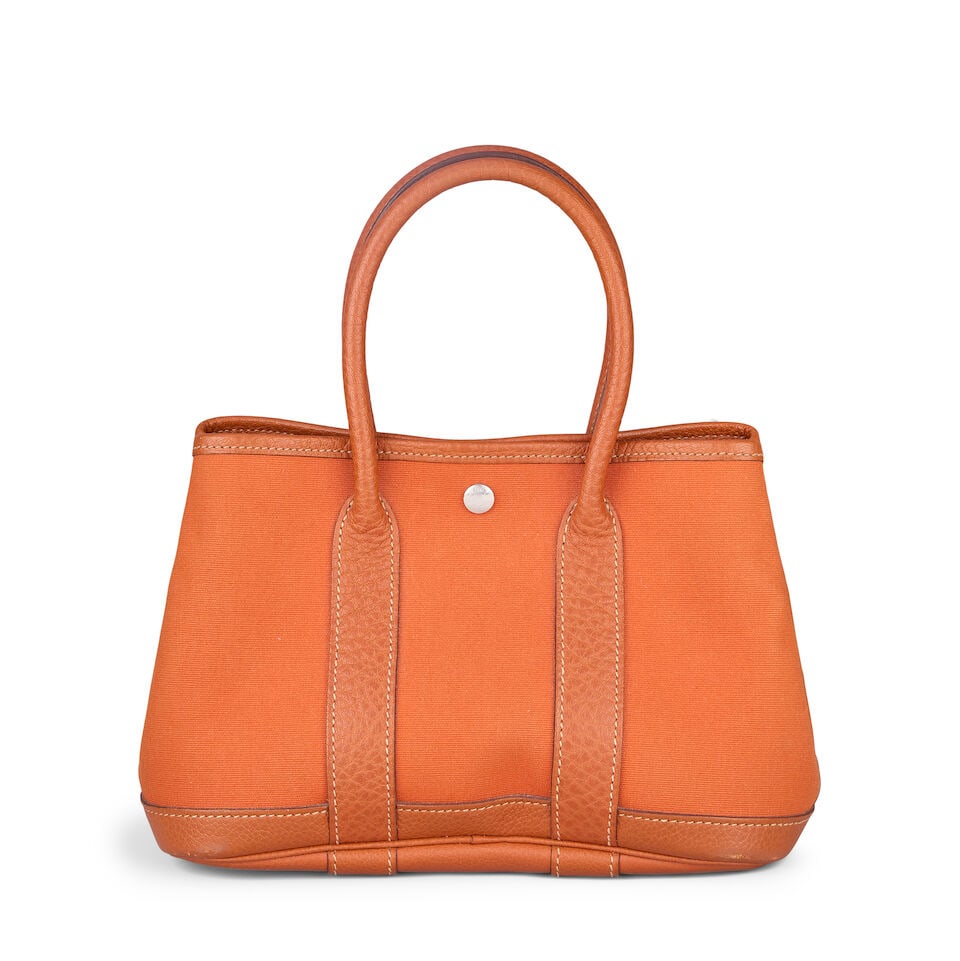 Hermès: a Potiron Toile Neo Garden Party 23 2005 (Staff Stamp): Hermès: a Potiron Toile Neo Garden Party 23 2005 Potiron orange canvas with Terre Battue Negonda leather trim, palladium hardware Condition Grade B 23cm wide, 17cm high, 11cm deep, 10cm handle dr