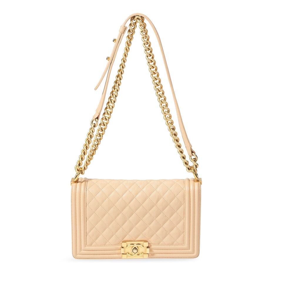 Chanel: a Beige Caviar Leather Medium Boy Bag 2016 (includes serial sticker, authenticity card, ...: Chanel: a Beige Caviar Leather Medium Boy Bag 2016 Creative Director: Karl Lagerfeld Quilted caviar leather with antique gold tone hardware Condition Grade B- 25cm wide, 15cm high, 9cm deep, 30/50cm s