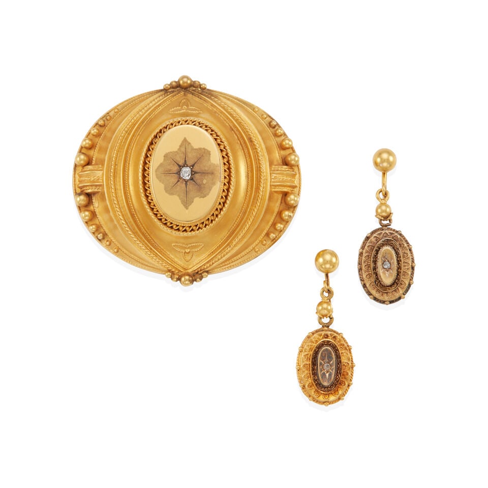 VICTORIAN GOLD BROOCH AND EARRINGS: VICTORIAN GOLD BROOCH AND EARRINGS •14k yellow gold oval brooch with 1 cushion shape old-mine diamond weighing approximately 0.05 carats total, and glass compartment in back dimensions: 1 5/8