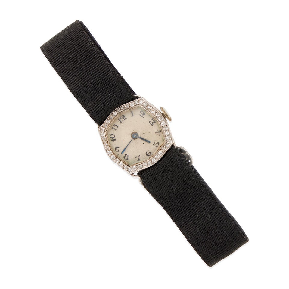 PLATINUM AND DIAMOND ART DECO ERA WATCH: PLATINUM AND DIAMOND ART DECO ERA WATCH •Platinum •Numerous round single diamonds weighing approximately 0.35 - 0.45 carats total •Mechanical movement not currently