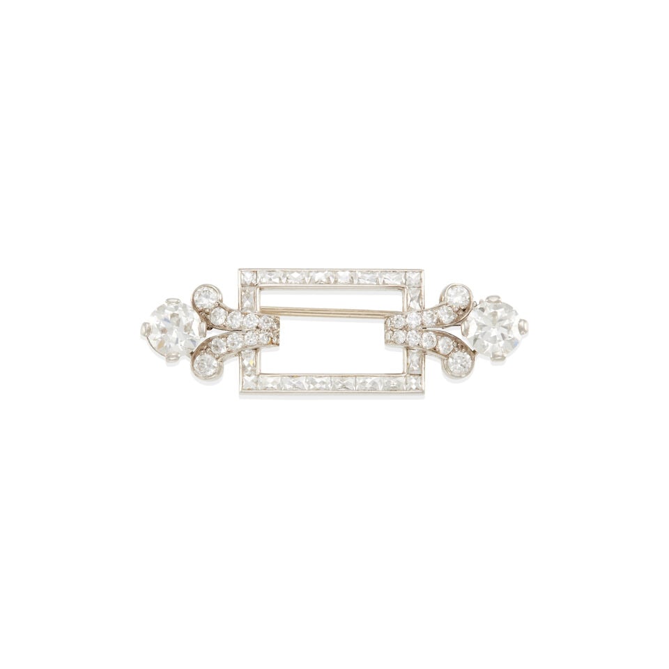 ART DECO PLATINUM AND DIAMOND BROOCH: ART DECO PLATINUM AND DIAMOND BROOCH • Platinum • 2 round diamonds weighing approximately 1.25 - 1.35 carat total • Numerous rectangular French-cut diamonds • Numerous round