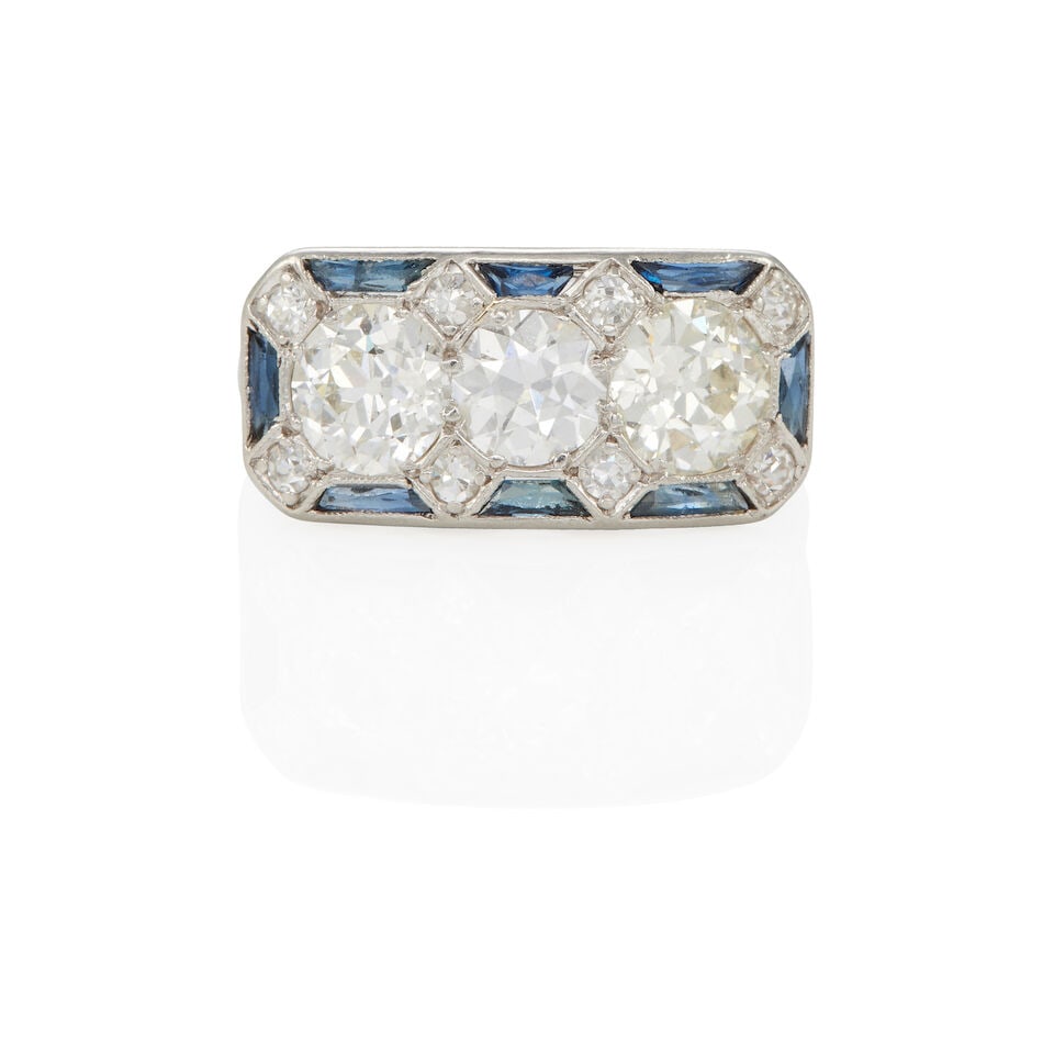 PLATINUM, DIAMOND, AND SYNTHETIC SAPPHIRE RING: PLATINUM, DIAMOND, AND SYNTHETIC SAPPHIRE RING •Platinum •11 round Old European and round single diamonds weighing approximately 2.05 - 2.10 carats total •8 calibre' synthetic