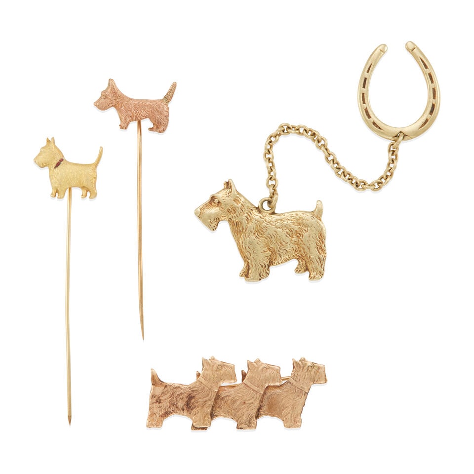VINTAGE 14K AND 9K GOLD ACCESSORIES: VINTAGE 14K AND 9K GOLD ACCESSORIES • One 14K gold horseshoe charm and one dog charm connected by a chain, length 4 in., estimated gross weight: 9.4 grams • One 14K gold brooch, length 1 1