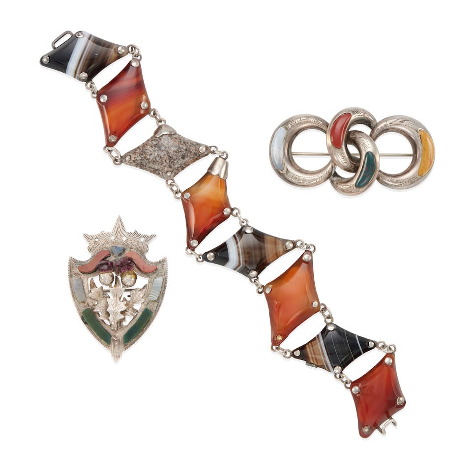 THREE ANTIQUE SILVER, AGATE, JASPER, AND GLASS JEWELRY ITEMS: THREE ANTIQUE SILVER, AGATE, JASPER, AND GLASS JEWELRY ITEMS •Sterling silver shield shape brooch with thistle motif, with various agate, jasper, and 2 violet glass stones, dimensions: 1 7/8 in