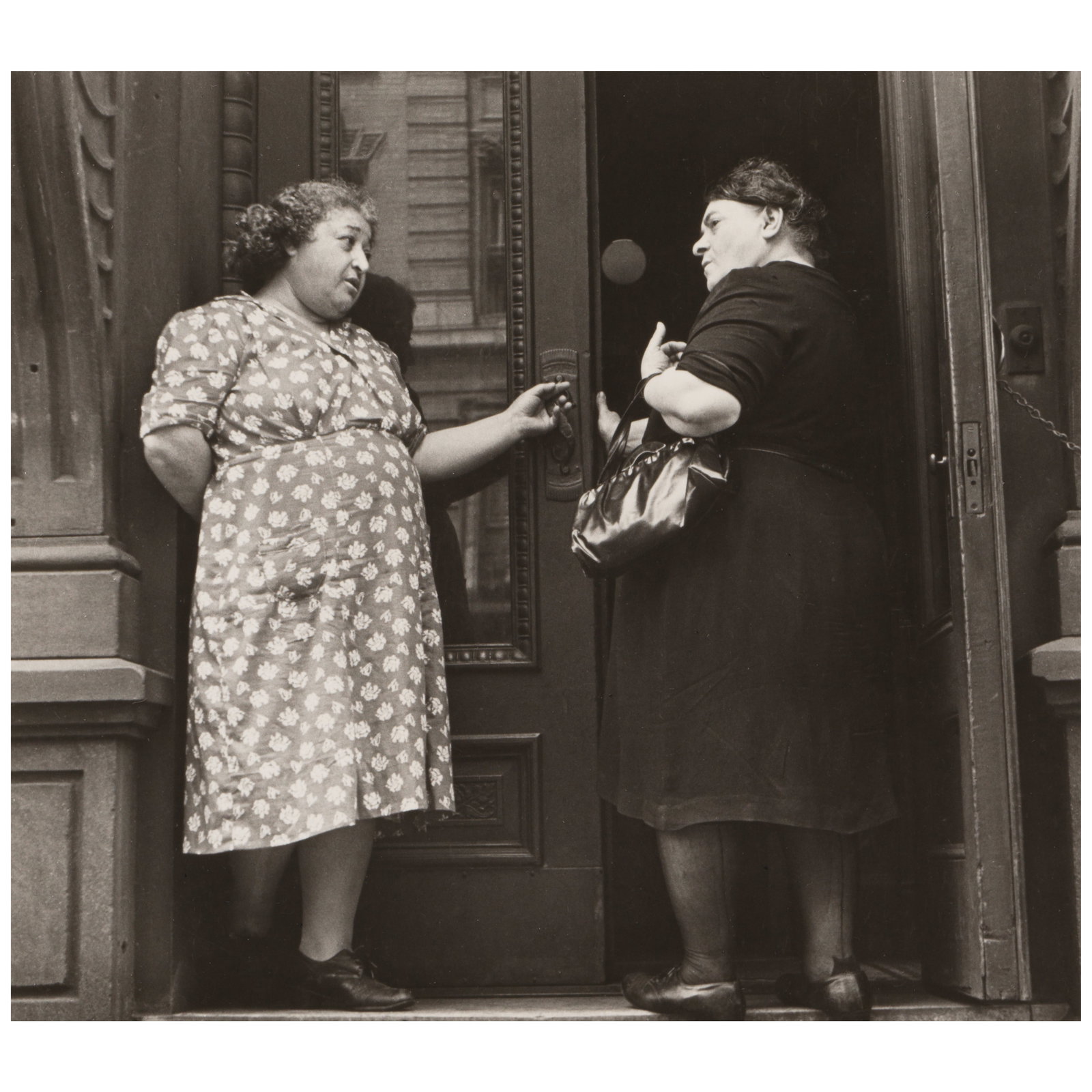 Helen Levitt (1913-2009); Untitled (Two Women in a Doorway, N.Y.);: Helen Levitt (1913-2009) Untitled (Two Women in a Doorway, N.Y.), c. 1942 Gelatin silver print, printed later; signed, dated, and annotated 'n.y.' in pencil on the reverse. 7 x 7 3/4 in. (17.8 x 19.7