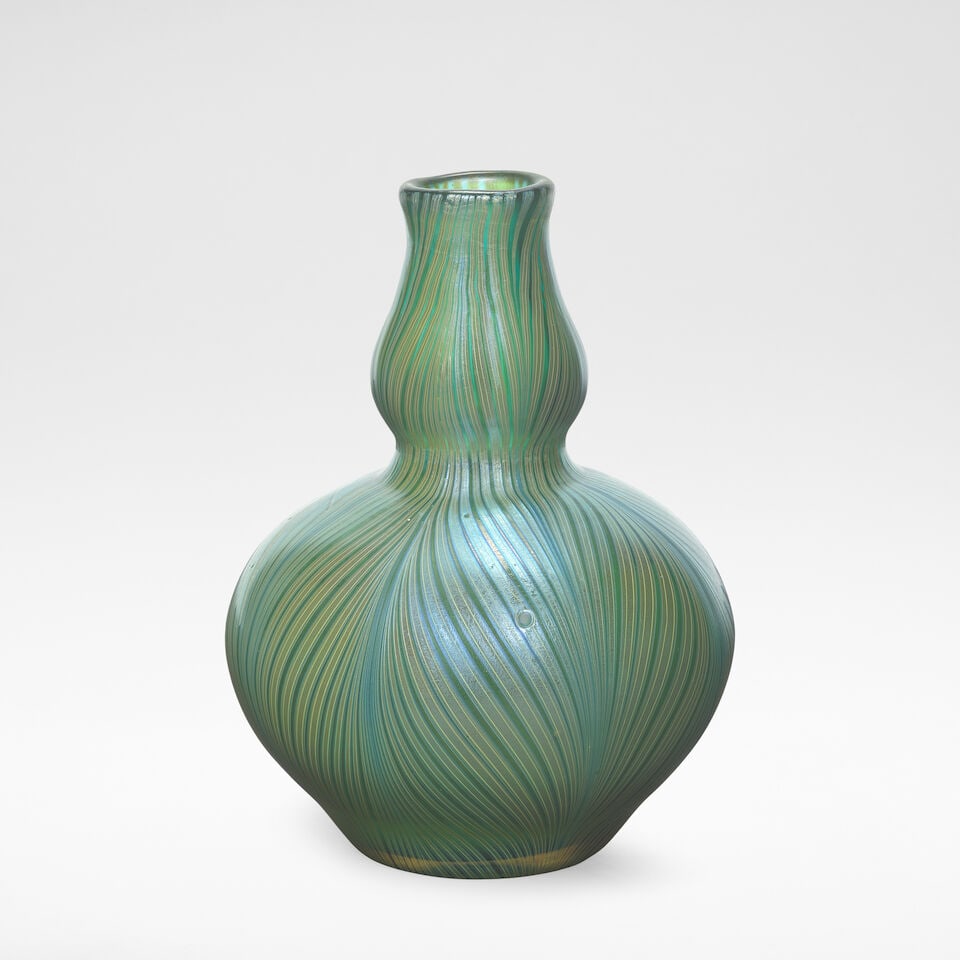 Loetz 'Phaenomen' vase, circa 1898: Loetz 'Phaenomen' vase, circa 1898 Phänomen Gre 7501, Crete glass with pulled iridescent bands in a feathered pattern. 14 cm high, 11 cm diameter Ground out pontil. Footnotes: Literature Helmut