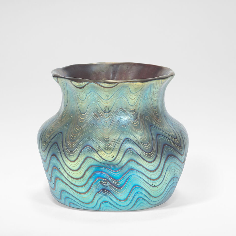 Loetz 'Rubin Phaenomen' vase circa 1898: Loetz 'Rubin Phaenomen' vase circa 1898 Phänomen Gre 6893, ruby glass with pulled iridescent bands in a wave pattern, the squat body with impressed sides. 8 cm high, 10 cm square Ground out