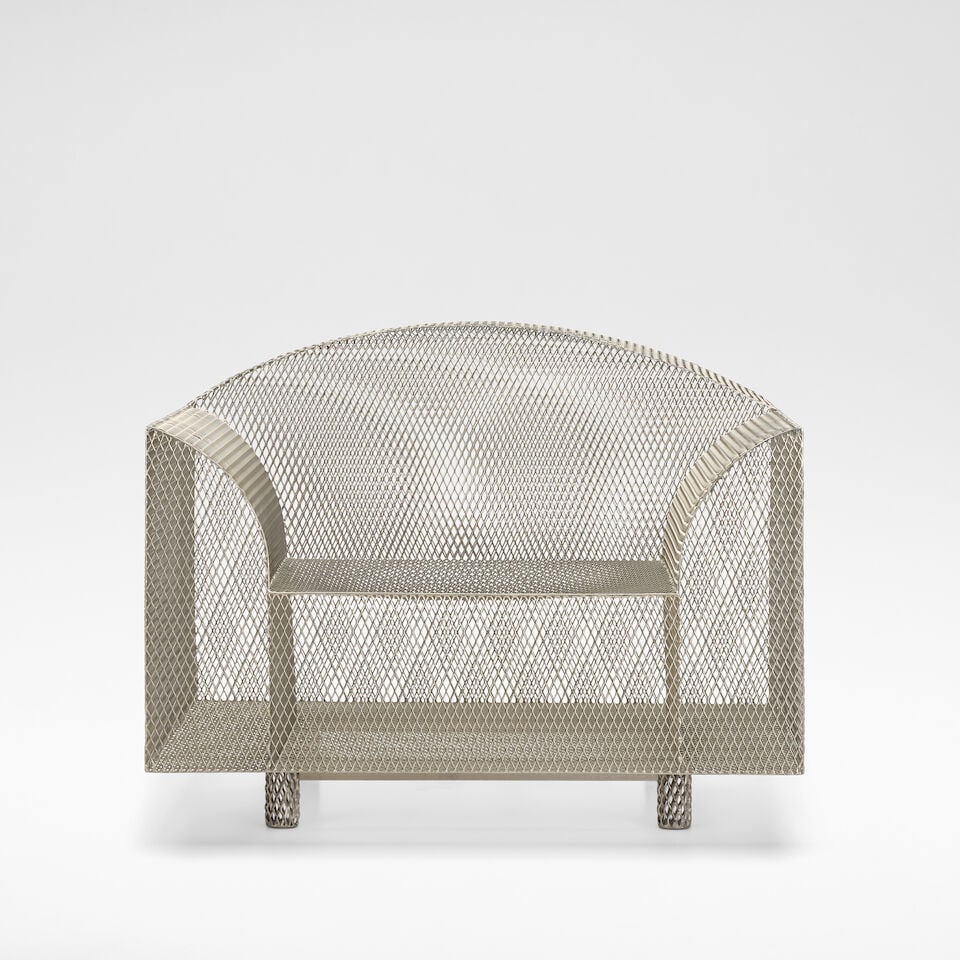 Shiro Kuramata 'How High the Moon', armchair, designed 1986: Shiro Kuramata 'How High the Moon', armchair, designed 1986 Nickel plated steel mesh. 73cm high, 96 cm wide, 83 cm deep Manufactured by Vitra, with manufacturer's label to the base. Footnotes: Literat
