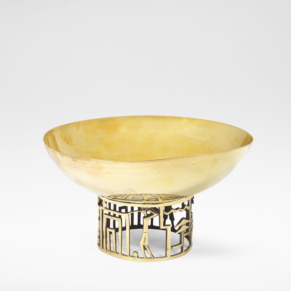 Karl Hagenauer for Werkstätte Hagenauer 'Golf' bowl, circa 1930: Karl Hagenauer for Werkstätte Hagenauer 'Golf' bowl, circa 1930 Brass, cast and moulded with stylised depictions of golfing scenes to the open base. 11 cm high, 19.8 cm diameter This lot is