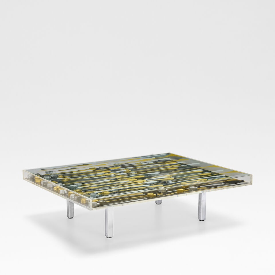 Arman 'Kerouan' table, 2004: Arman 'Kerouan' table, 2004 Plexiglas, glass, steel with nail polish bottles. 35 cm high, 126 cm wide, 100 cm deep Signed and numbered 20 KERUAN 04 on label affixed to the underside This lot is