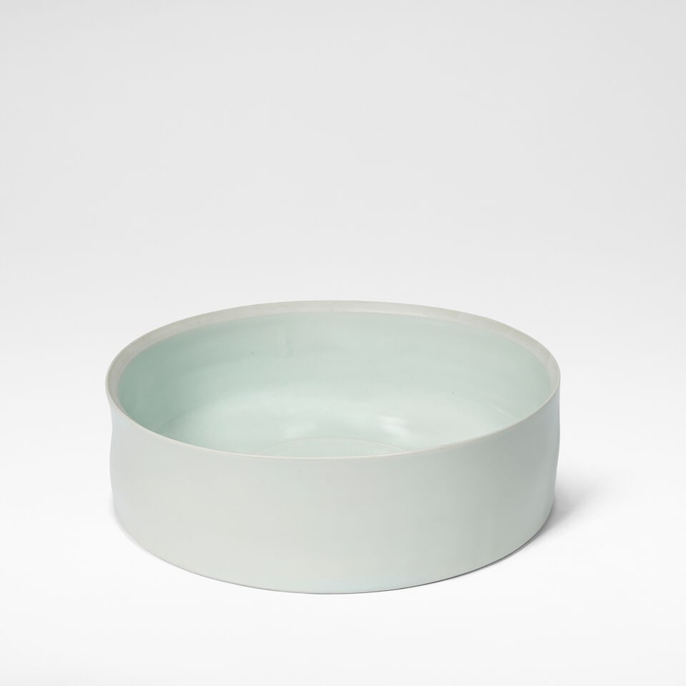 Edmund de Waal Large low cylinder, circa 2000: Edmund de Waal Large low cylinder, circa 2000 Porcelain, pale blue celadon glaze, with unglazed interior rim and ridged band to well. 8.5 cm high, 28 cm diameter Side impressed with maker's marks.