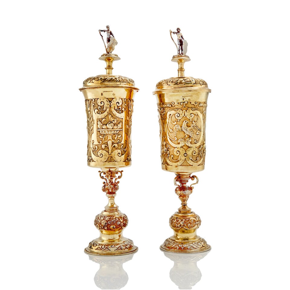 Two German Renaissance silver-gilt cups and covers both David Cramer (Kramer), Augsburg, circa 1...: Two German Renaissance silver-gilt cups and covers both David Cramer (Kramer), Augsburg, circa 1575 - 1595, one cover apparently unmarked Each with a cylindrical cup embossed and chased with stylised 
