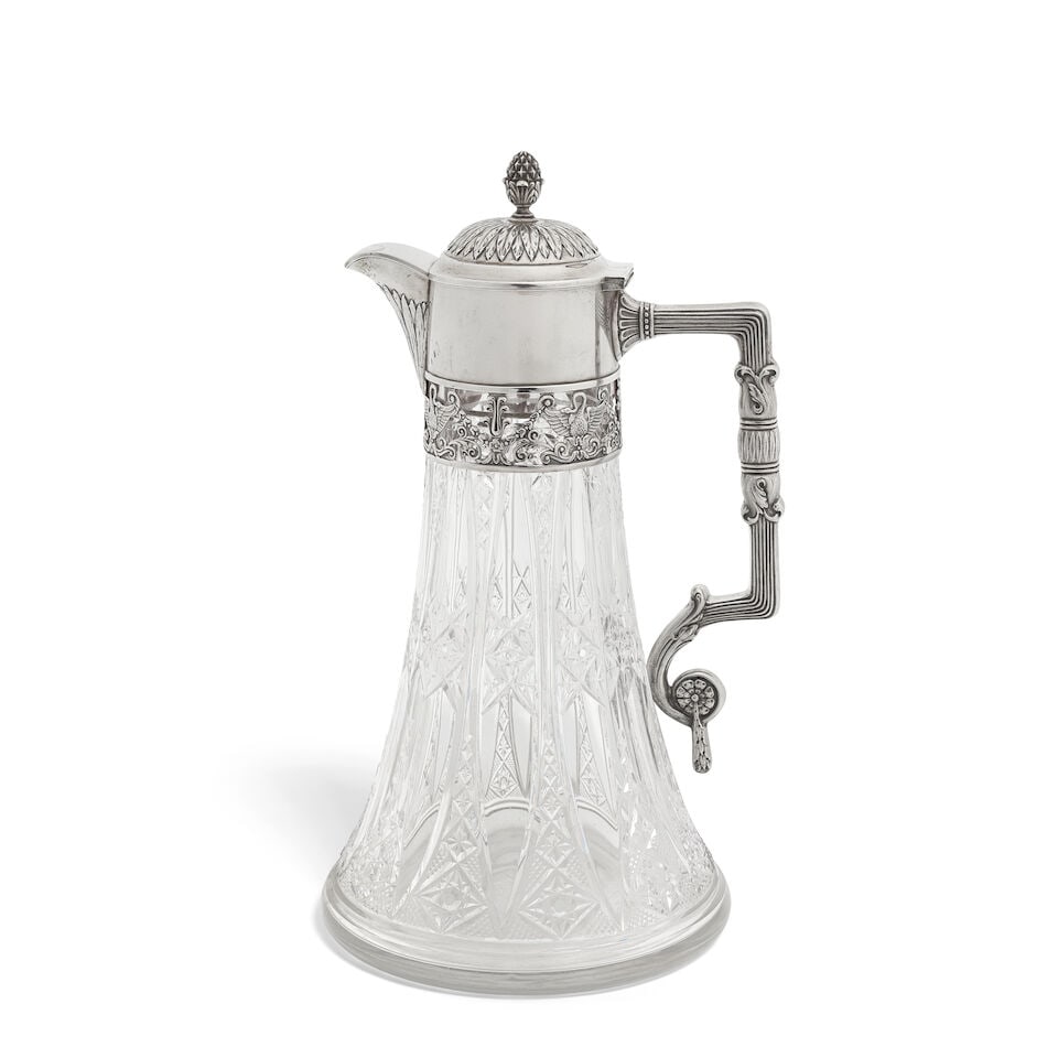 A Russian silver-mounted glass claret jug 4th Artel, post 1908, with 84 zolotnik mark: A Russian silver-mounted glass claret jug 4th Artel, post 1908, with 84 zolotnik mark Cylindrical collar with open-work band below, with swans, wings outstretched among husk swags and scrolls, the hin