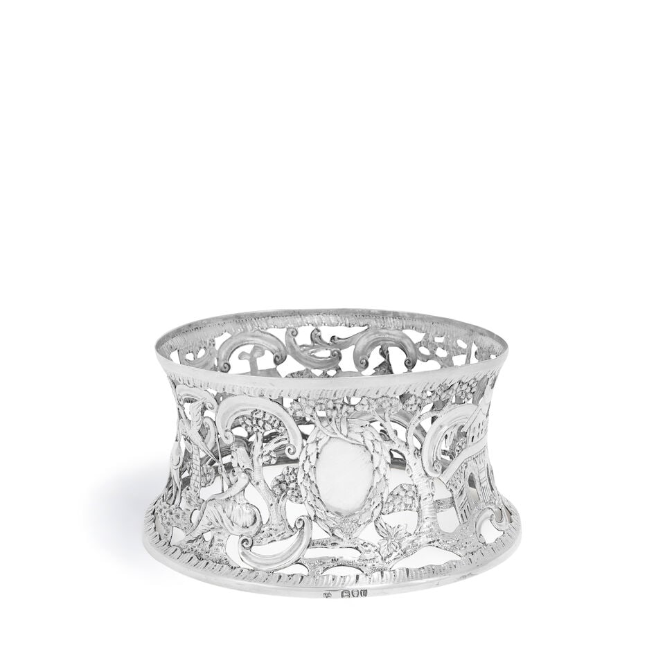 A Victorian silver dish ring Langley Archer West (West & Son), of Dublin, London 1895: A Victorian silver dish ring Langley Archer West (West & Son), of Dublin, London 1895 Of conventional form, with pierced decoration, embossed with, animals, pastoral buildings, and figures, among tree