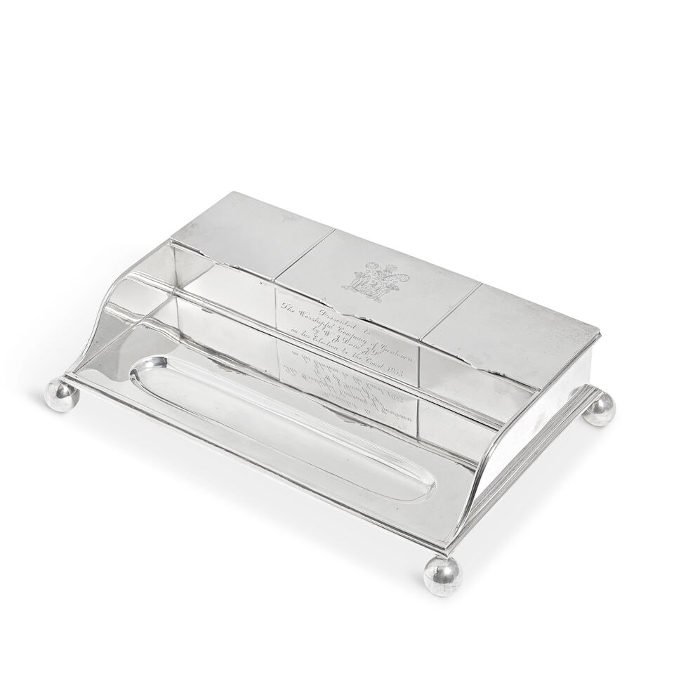 A Victorian silver inkstand George Fox, London 1881: A Victorian silver inkstand George Fox, London 1881 Rectangular form, with a pen depression in front of three compartments, each with hinged cover, the central compartment engraved with the Worshipful