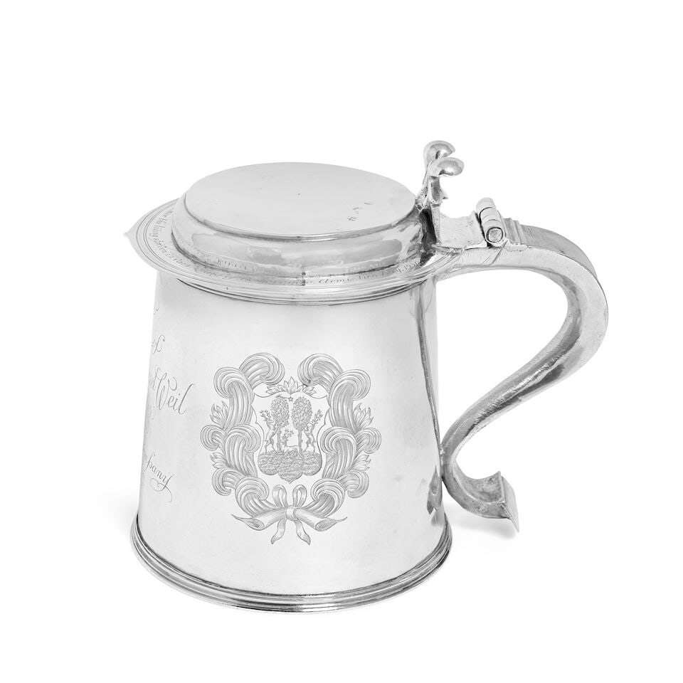 A Charles II silver lidded tankard maker's mark TL with device below, London 1670: A Charles II silver lidded tankard maker's mark TL with device below, London 1670 The hinged stepped flat top cover with scroll thumb piece, the rim of the cover with inscription, quoting a speech giv