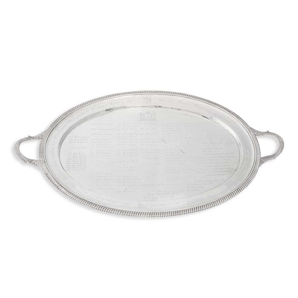 A George III silver 'Worshipful Company of Gardeners' Past Masters' two-handled tray William Ben...: A George III silver 'Worshipful Company of Gardeners' Past Masters' two-handled tray William Bennett, London 1809 Oval form with gadroon rim, the gadroon handles with leaf junctions, engraved around t