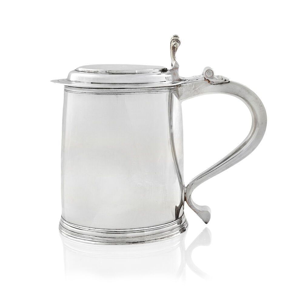 A William and Mary silver tankard Francis Singleton, London 1694: A William and Mary silver tankard Francis Singleton, London 1694 Plain tapering form with moulded rim, flat and very slightly domed cover applied with a scroll thumbpiece, the scroll handle engraved '