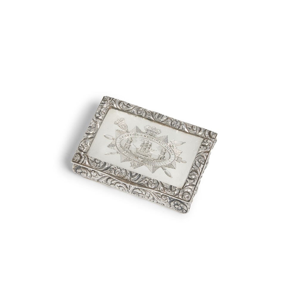 An George IV Irish silver City of Cork freedom box James Scott, Dublin 1828: An George IV Irish silver City of Cork freedom box James Scott, Dublin 1828 Rectangular, the hinged lid engraved with the arms of the City of Cork, with cast scrolling foliate border, with bombe sides