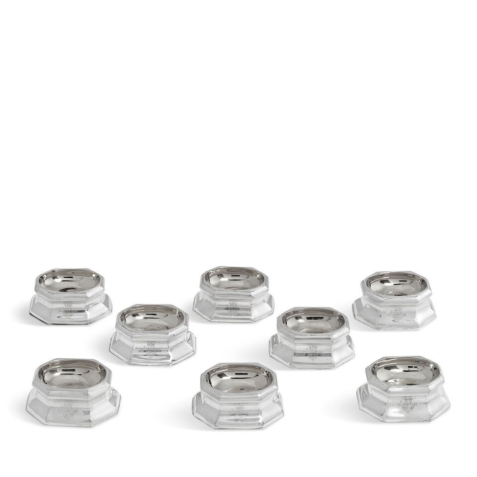 Eight cast metalware trencher salts unmarked (8): Eight cast metalware trencher salts unmarked Conventional form, waisted octagonal form with plain panelled sides, the front with modern engraved Royal Cypher for George II, welled centred gilded, leng