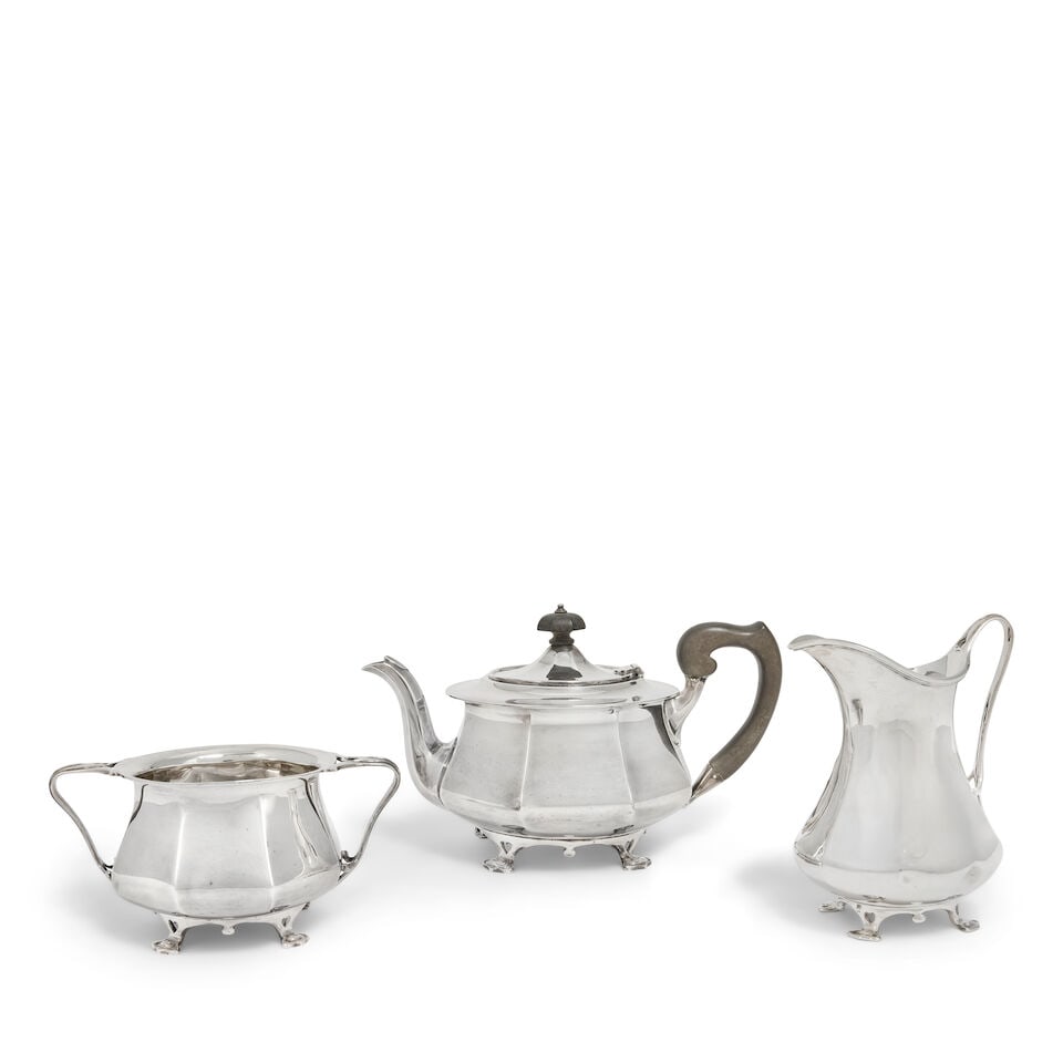 A matched silver three-piece tea service Goldsmiths & Silversmiths Company Ltd, Sheffield 1920, ... (1 of 2)